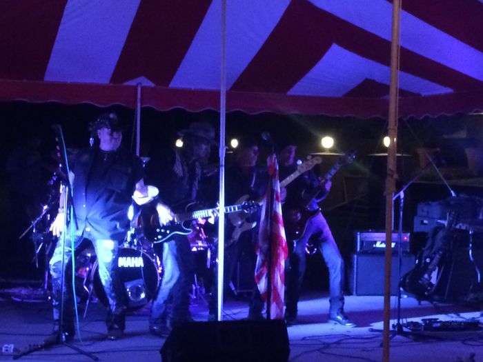 A live band playing under the party tent