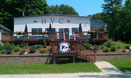 The HYC clubhouse with its deck and club burgee sign