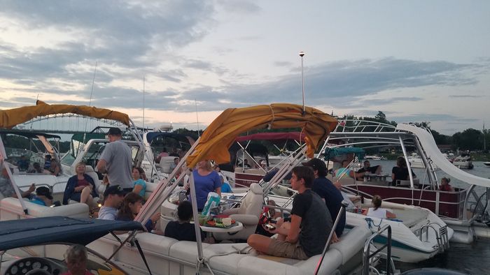 Boats rafted up together at sunset